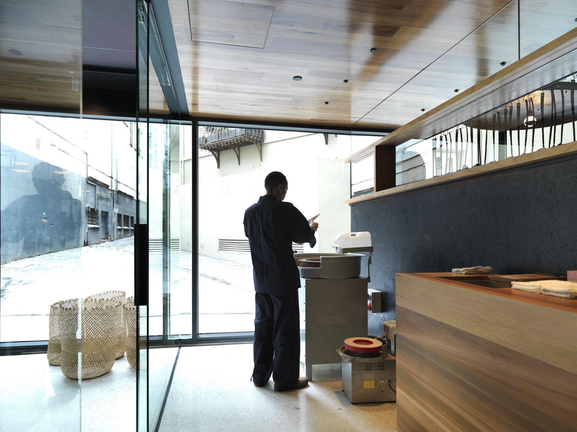 Qt Melbourne Hotel Exterior photo A barista at work